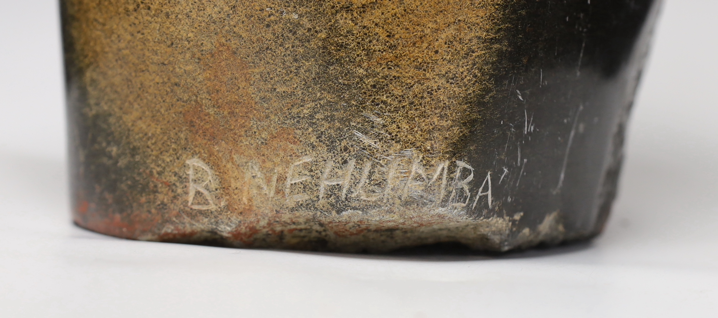 A Zimbabwe soapstone carving of two embracing figures, signed B Nehlimba, 53cm high